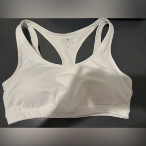 No stains, only worn a couple of times, size large Athleta white sports bra
